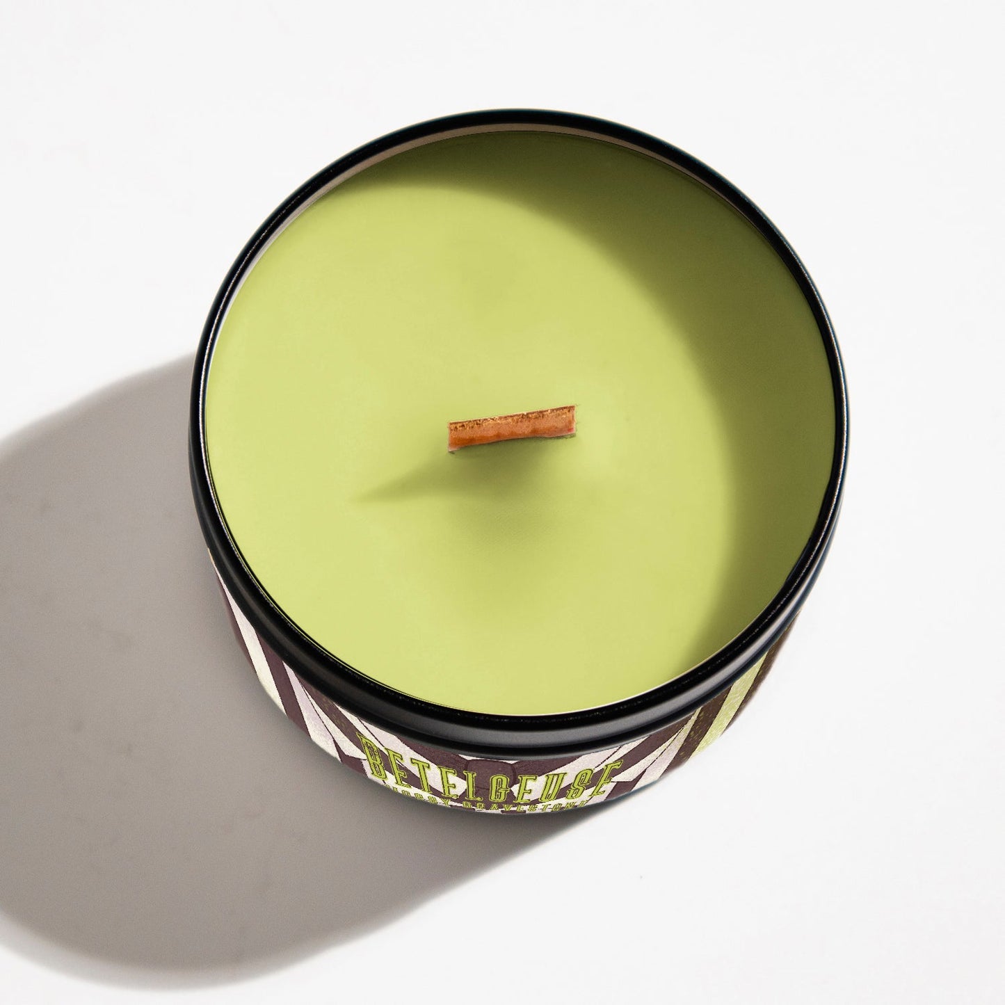 Hand-poured Betelgeuse candle with mossy graveyard scent, inspired by classic afterlife comedy