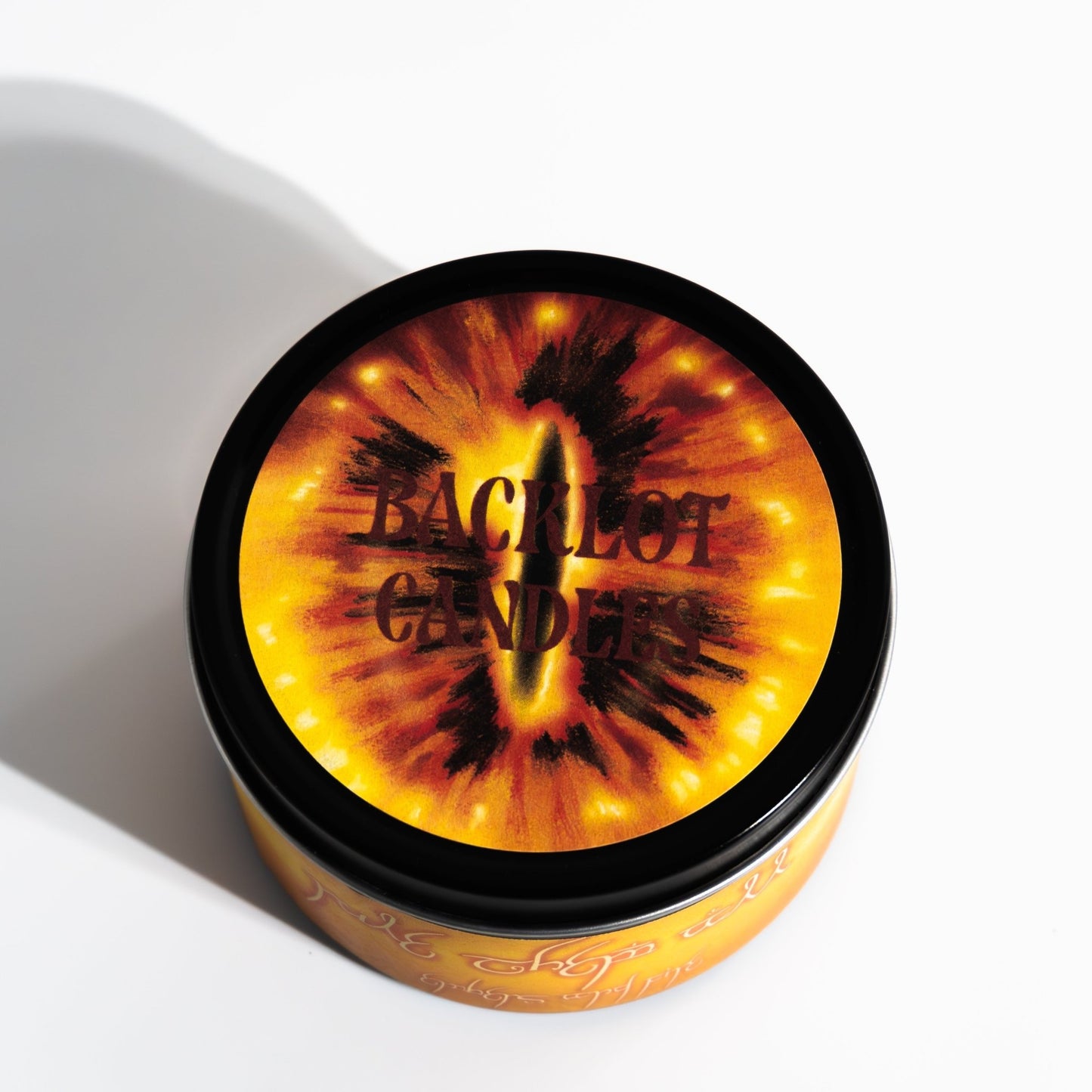 Hand-poured soy candle named Rule Them All with embers and fire scent, inspired by fantasy adventure